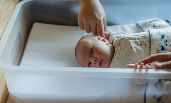 Close up of newborn baby in pepi pod