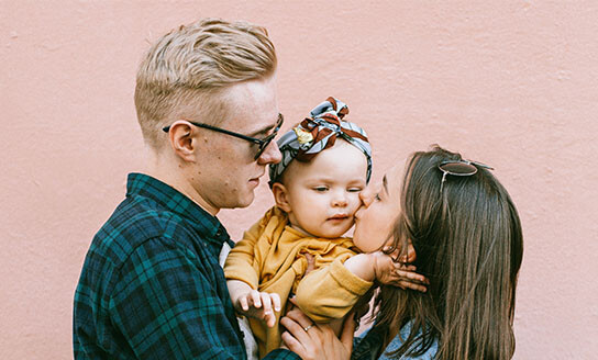 Looking after your relationship Mum kissing child