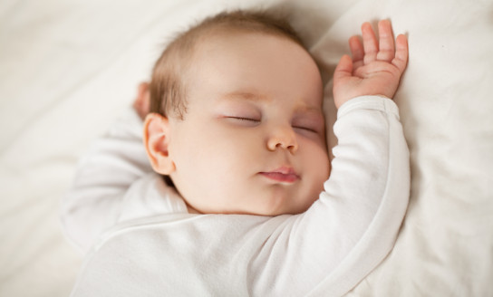 Sleeping newborn baby on white background. Small sleeping child bedtime baby up to one month 1005939262 2125x1416
