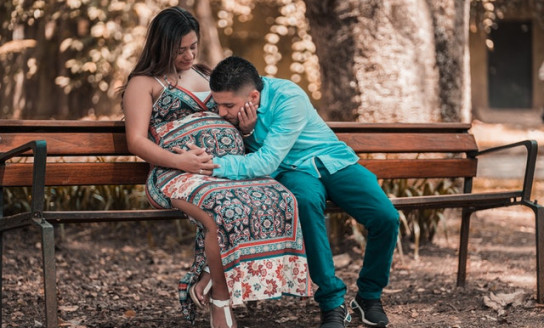 man in blue long sleeve shirt with woman in a floral dress 3642526