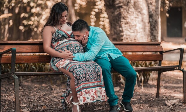 man in blue long sleeve shirt with woman in a floral dress 3642526