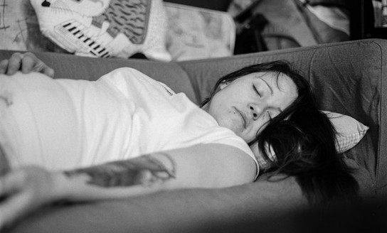 woman in white shirt sleeping on gray fabric sofa 156085